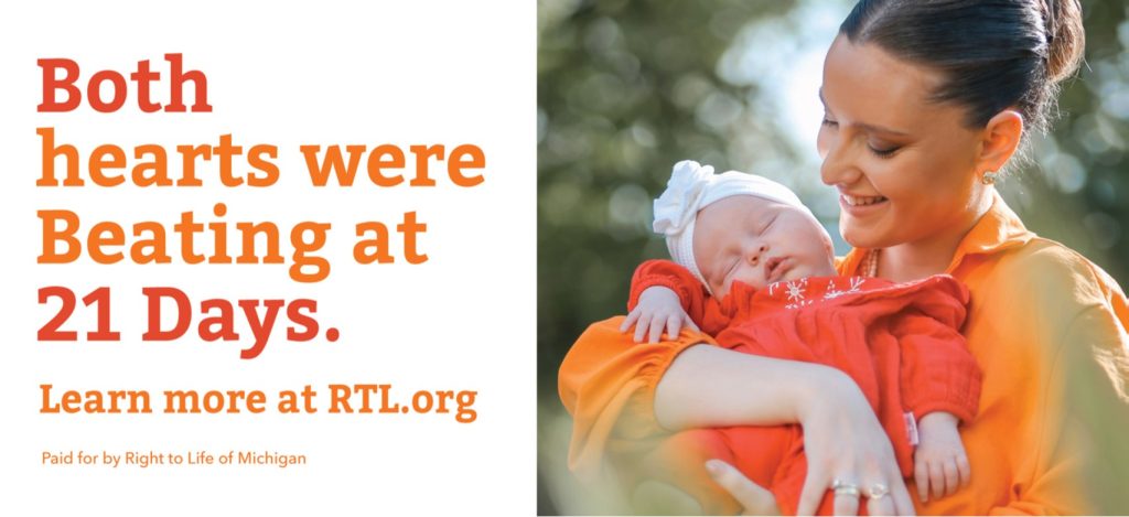 woman holding baby with text: Both hearts were beating at 21 days.